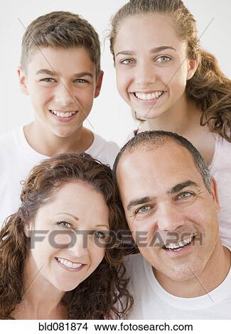 Portrait of smiling Hispanic family View Large Photo Image Picture - Portrait of smiling Hispanic family. Fotosearch