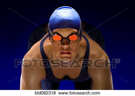 Serious swimmer in swim cap and goggles View Large Photo Image Stock Photo - Serious swimmer in swim cap and goggles. Fotosearch