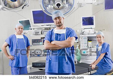Surgeons in hospital operating room View Large Photo Image Stock Photography - Surgeons in hospital operating room. Fotosearch
