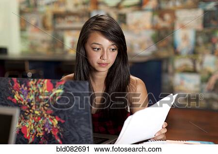 Asian girl studying on laptop View Large Photo Image Stock Image - Asian girl studying on laptop. Fotosearch