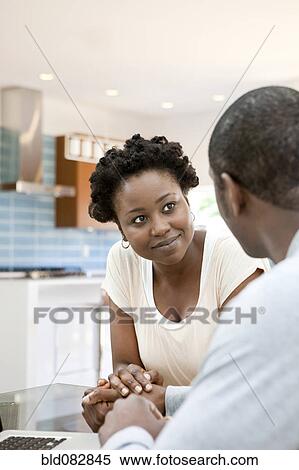 Black couple holding hands in kitchen View Large Photo Image Stock Photography - Black couple holding hands in kitchen. Fotosearch