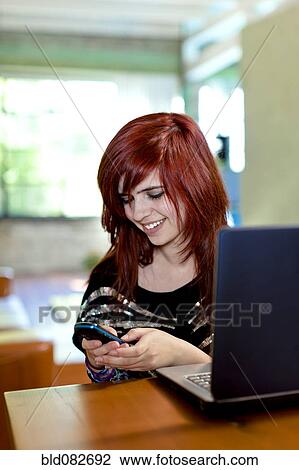Caucasian teenager text messaging on cell phone View Large Photo Image Stock Image - Caucasian teenager text messaging on cell phone. Fotosearch