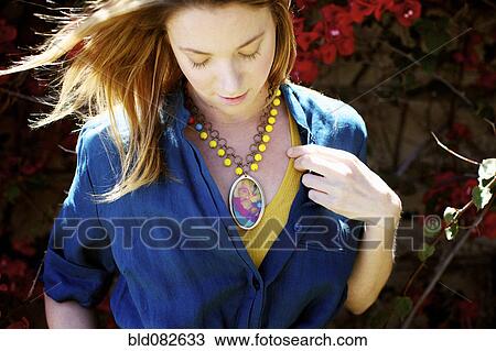 Caucasian woman wearing necklace View Large Photo Image Stock Image - Caucasian woman wearing necklace. Fotosearch