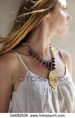 Caucasian woman wearing necklace View Large Photo Image Stock Photo - Caucasian woman wearing necklace. Fotosearch