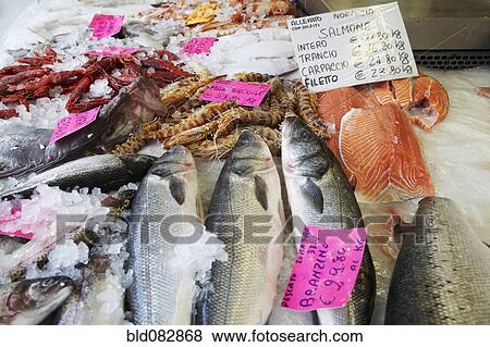 Stock Photo - Close up of fish on ice in market. Fotosearch