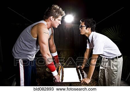 Geek and body builder playing chess View Large Photo Image Stock Image - Geek and body builder playing chess. Fotosearch