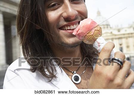 Italian man eating ice cream cone View Large Photo Image Stock Image - Italian man eating ice cream cone. Fotosearch