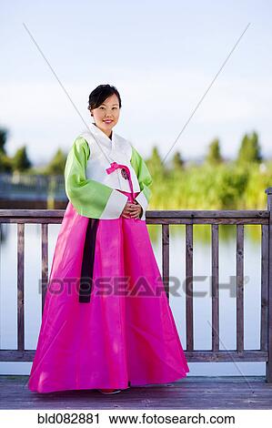 Korean woman in traditional clothing View Large Photo Image Stock Image - Korean woman in traditional clothing. Fotosearch