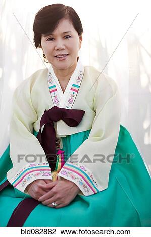 Stock Image - Korean woman in traditional clothing. Fotosearch