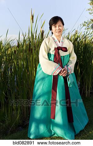 Korean woman in traditional clothing View Large Photo Image Stock Image - Korean woman in traditional clothing. Fotosearch