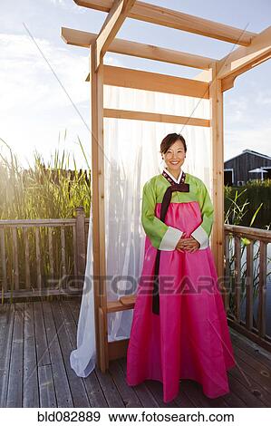 Korean woman in traditional clothing View Large Photo Image Stock Photo - Korean woman in traditional clothing. Fotosearch