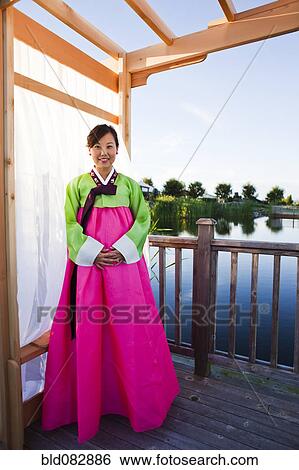 Korean woman in traditional clothing View Large Photo Image Stock Photograph - Korean woman in traditional clothing. Fotosearch