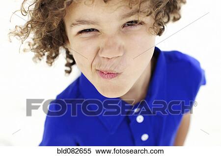 Mixed race boy grimacing View Large Photo Image Stock Photography - Mixed race boy grimacing. Fotosearch