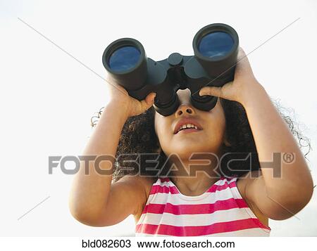 Mixed race girl looking through binoculars View Large Photo Image Stock Image - Mixed race girl looking through binoculars. Fotosearch