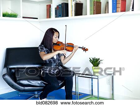 Mixed race girl practicing violin View Large Photo Image Stock Photo - Mixed race girl practicing violin. Fotosearch