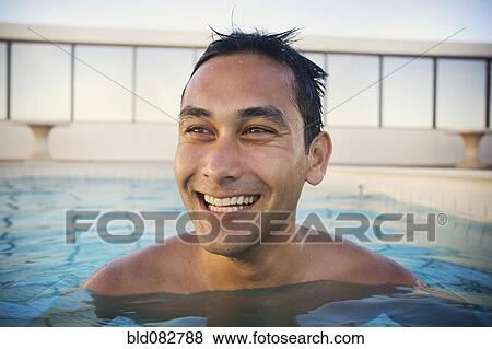 Mixed race man swimming in swimming pool View Large Photo Image Stock Photo - Mixed race man swimming in swimming pool. Fotosearch