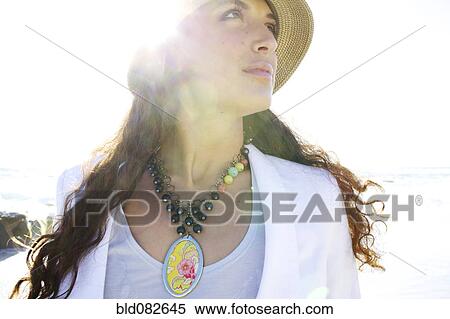 Mixed race woman in hat and necklace View Large Photo Image Stock Photography - Mixed race woman in hat and necklace. Fotosearch