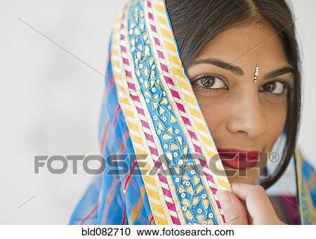 Stock Image - Mixed race woman in traditional Indian clothing. Fotosearch