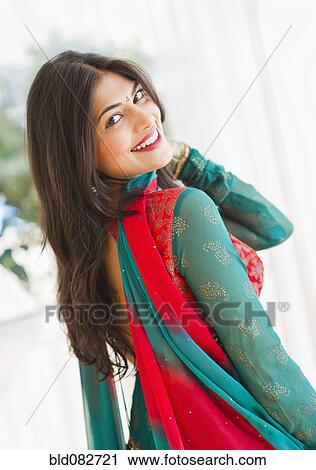 Stock Image - Mixed race woman in traditional Indian clothing. Fotosearch