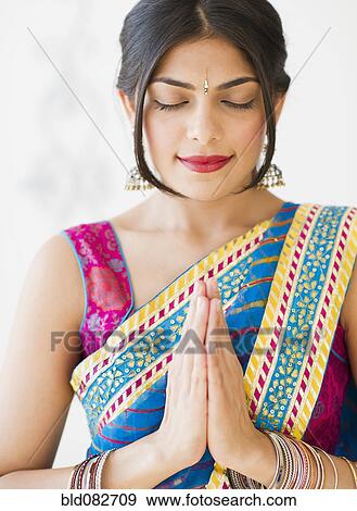Stock Photo - Mixed race woman in traditional Indian clothing. Fotosearch