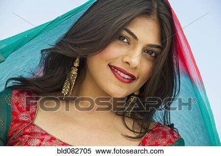 Stock Photography - Mixed race woman in traditional Indian clothing. Fotosearch