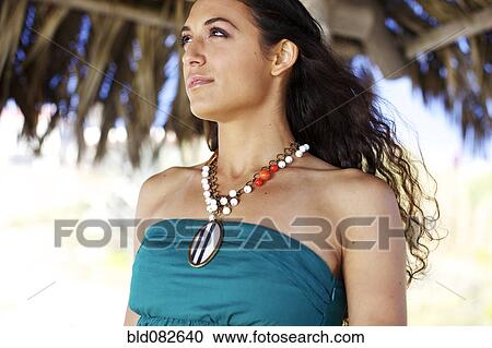 Mixed race woman wearing necklace View Large Photo Image Stock Image - Mixed race woman wearing necklace. Fotosearch