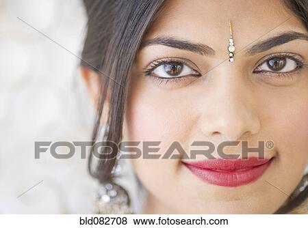 Mixed race woman with bindi on forehead View Large Photo Image Stock Photo - Mixed race woman with bindi on forehead. Fotosearch