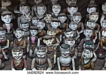 Picture - Rows of Vietnamese puppet figures. Fotosearch