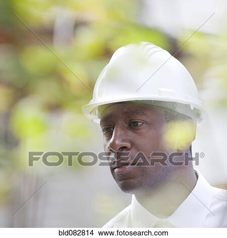 Serious Black man in hard-hat View Large Photo Image Picture - Serious Black man in hard-hat. Fotosearch