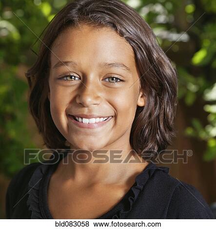 Stock Photo - Smiling African American girl. Fotosearch