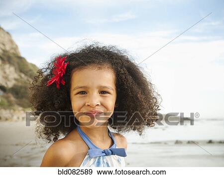 Smiling mixed race girl on beach View Large Photo Image Stock Photo - Smiling mixed race girl on beach. Fotosearch