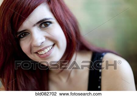 Stock Image - Smiling redheaded teenager. Fotosearch