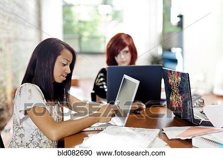 Teenage girls studying together View Large Photo Image Stock Image - Teenage girls studying together. Fotosearch