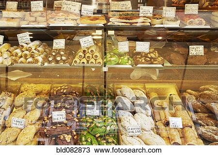Stock Image - Variety of cookies in display case. Fotosearch