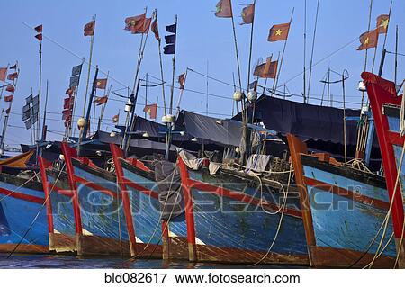 Stock Photo - Vietnamese boats moored in harbor. Fotosearch