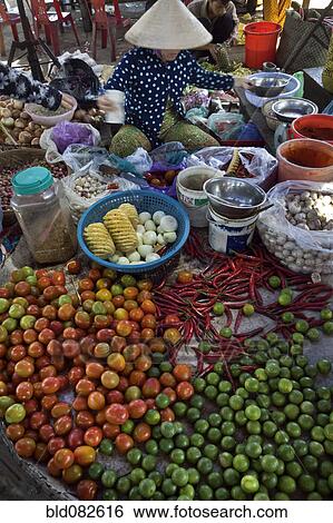 Stock Photograph - Vietnamese woman selling vegetables. Fotosearch