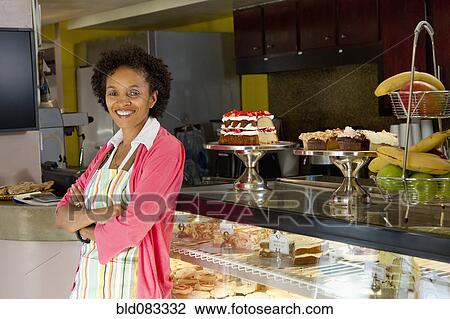 African American bakery owner standing in shop View Large Photo Image Stock Image - African American bakery owner standing in shop. Fotosearch