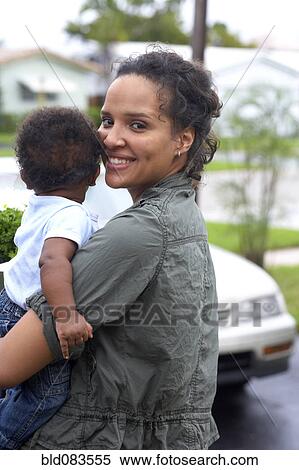 African American mother carrying baby View Large Photo Image Stock Photography - African American mother carrying baby. Fotosearch