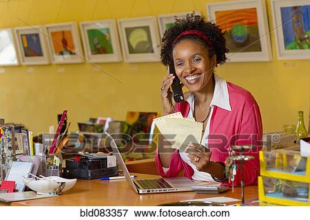 African American small business owner working in shop View Large Photo Image Stock Photo - African American small business owner working in shop. Fotosearch