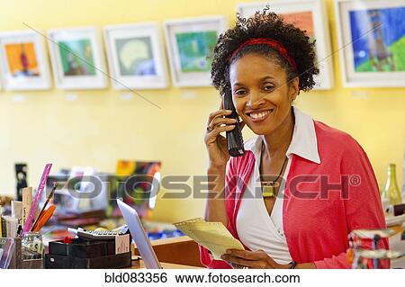 African American small business owner working in shop View Large Photo Image Stock Photograph - African American small business owner working in shop. Fotosearch