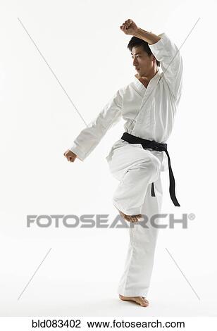 Asian male black belt practicing karate View Large Photo Image Stock Image - Asian male black belt practicing karate. Fotosearch