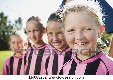 Caucasian girl soccer players smiling View Large Photo Image Stock Image - Caucasian girl soccer players smiling. Fotosearch