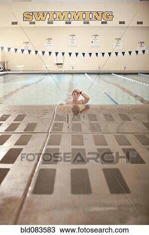 Stock Image - Caucasian swimmer in swimming pool. Fotosearch
