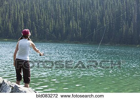 Caucasian woman fishing in lake View Large Photo Image Stock Image - Caucasian woman fishing in lake. Fotosearch