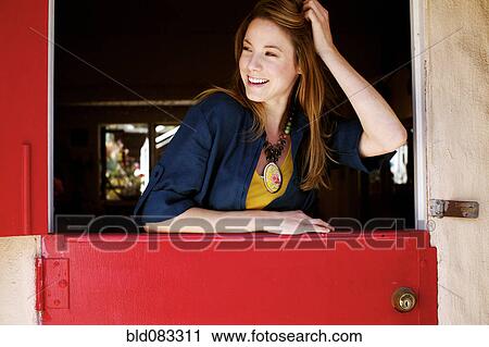 Caucasian woman standing in doorway View Large Photo Image Stock Image - Caucasian woman standing in doorway. Fotosearch