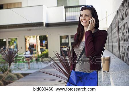 Caucasian woman talking on cell phone View Large Photo Image Stock Image - Caucasian woman talking on cell phone. Fotosearch
