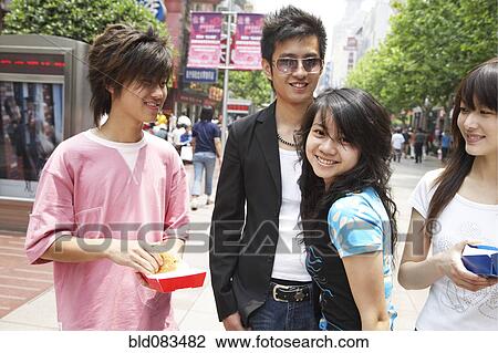 Chinese friends eating fast food together View Large Photo Image Stock Image - Chinese friends eating fast food together. Fotosearch