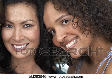 Stock Photograph - Close up of women smiling. Fotosearch