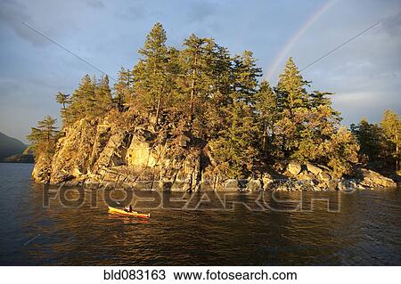 Hispanic woman kayaking on lake View Large Photo Image Stock Image - Hispanic woman kayaking on lake. Fotosearch