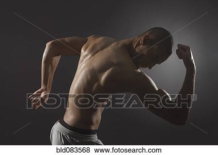 Mixed race athlete flexing biceps View Large Photo Image Stock Photo - Mixed race athlete flexing biceps. Fotosearch